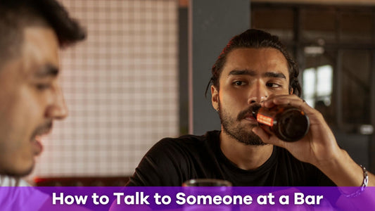 man drinking beer thinking how to talk to someone at the bar