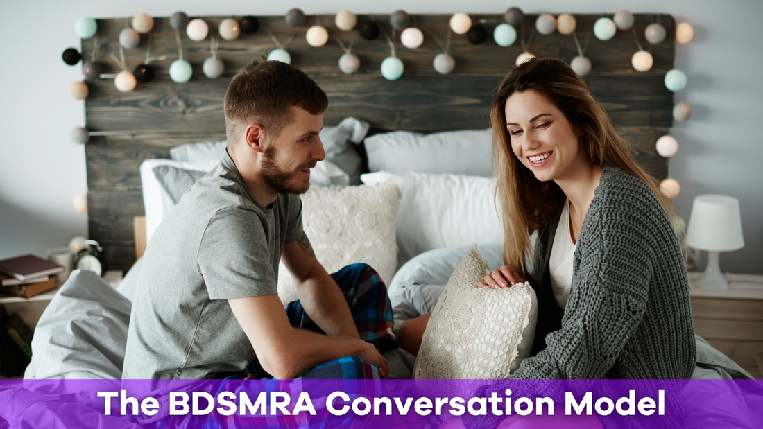A couple in bed using the BDSMRA conversation model to talk about their relationship. 